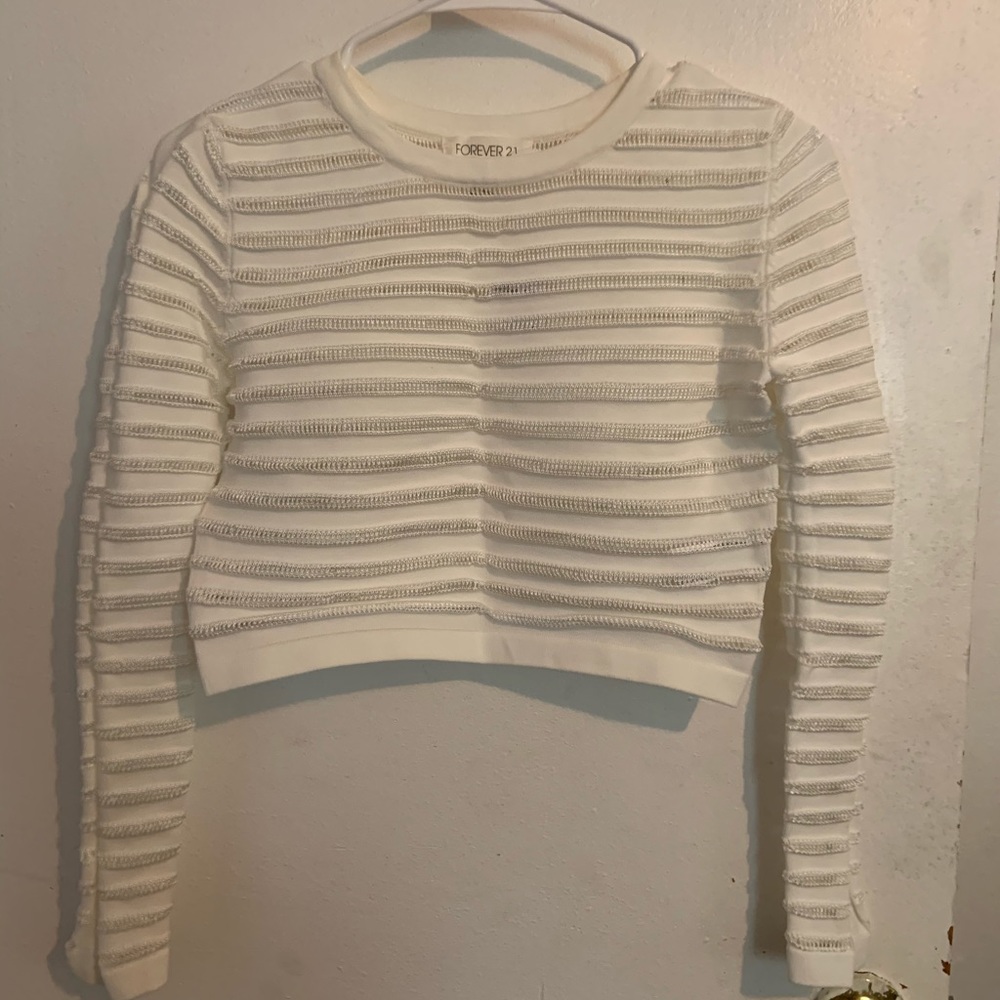 Cream/white crop top. See-through lacing stripes.